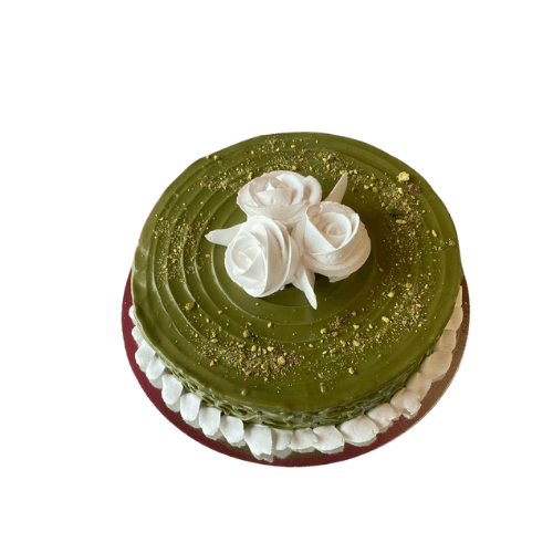 Pistachio cream cake with blue roses in a transparent box view 2