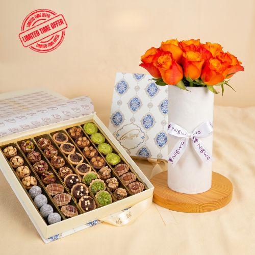 Mix Cookies Box with orange flowers vase view 1