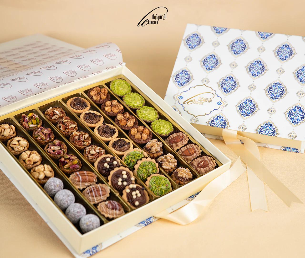 Mix Cookies Box with orange flowers vase view 2