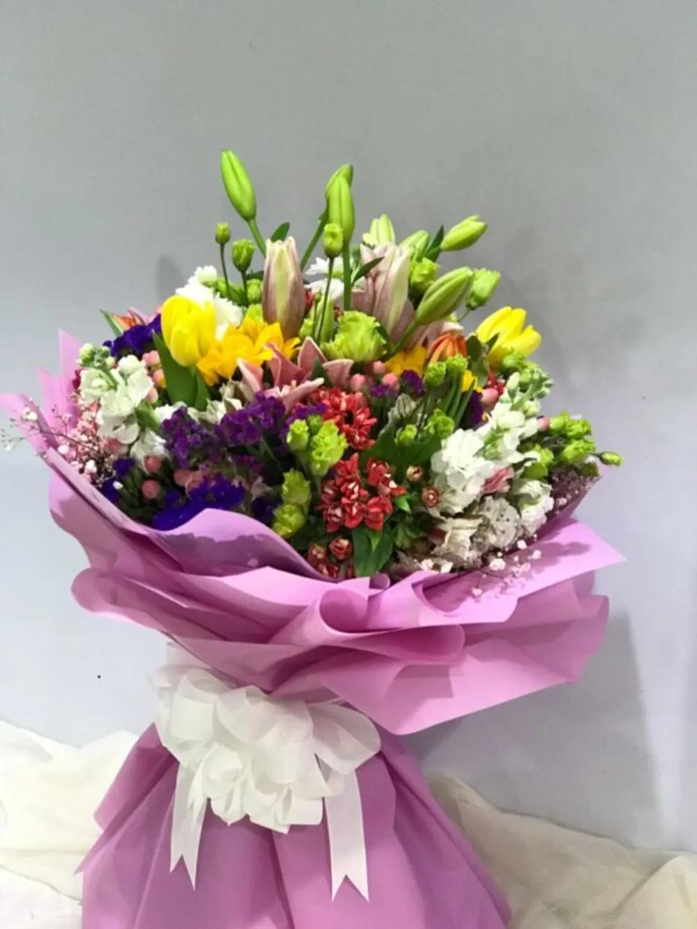 Mixed bouquet with light purple wrapperundefined