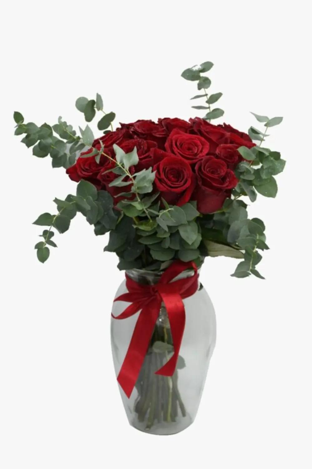 red roses and some eucalyptus with glass Nundefined
