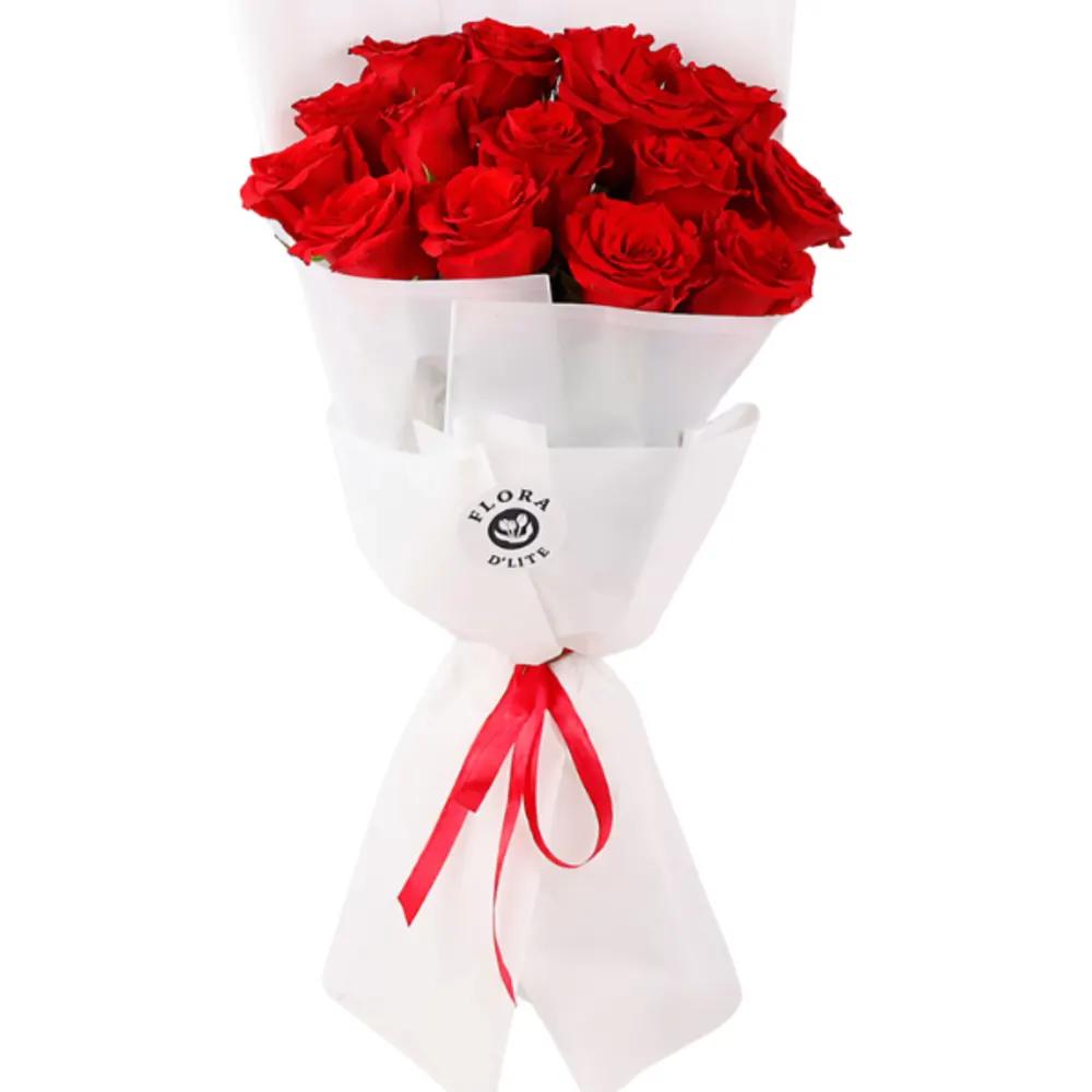 A bouquet of red roses with a white wrapperundefined