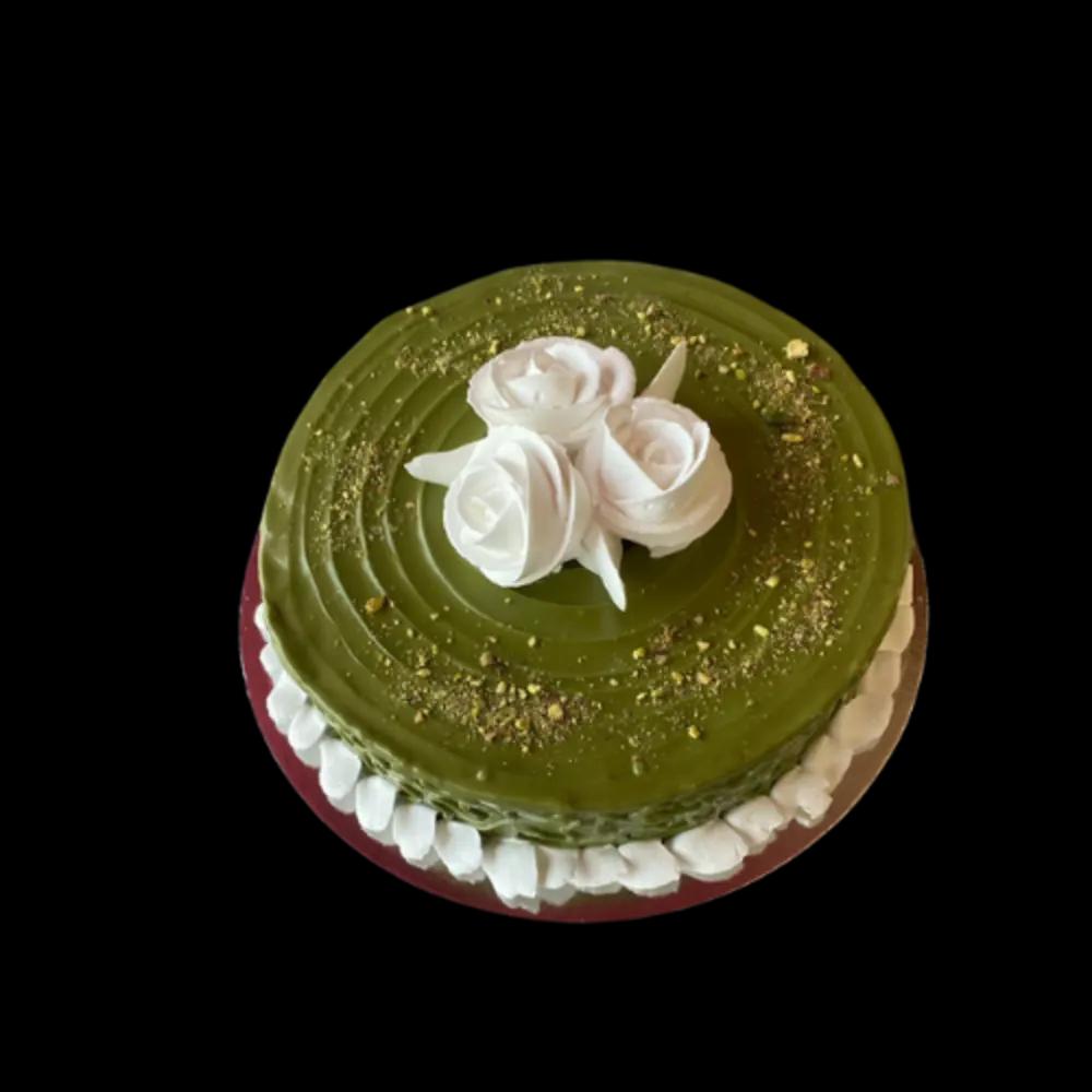 Cakes with pistachio cream and decorated with flowersundefined