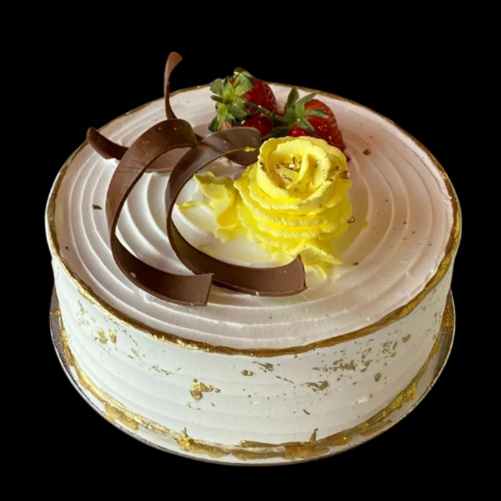 Cake with white cream and decorated with yellow cream and strawberriesundefined