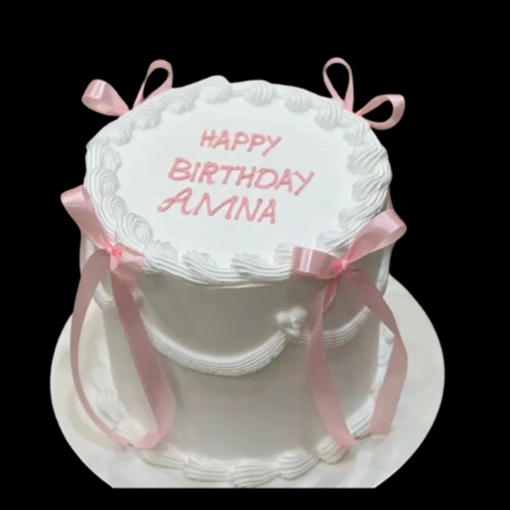 White birthday cake with pink ribbonsWhite Birthday Cake with Pink Ribbons, كيك عيد ميلاد أبيض بشرائط وردية