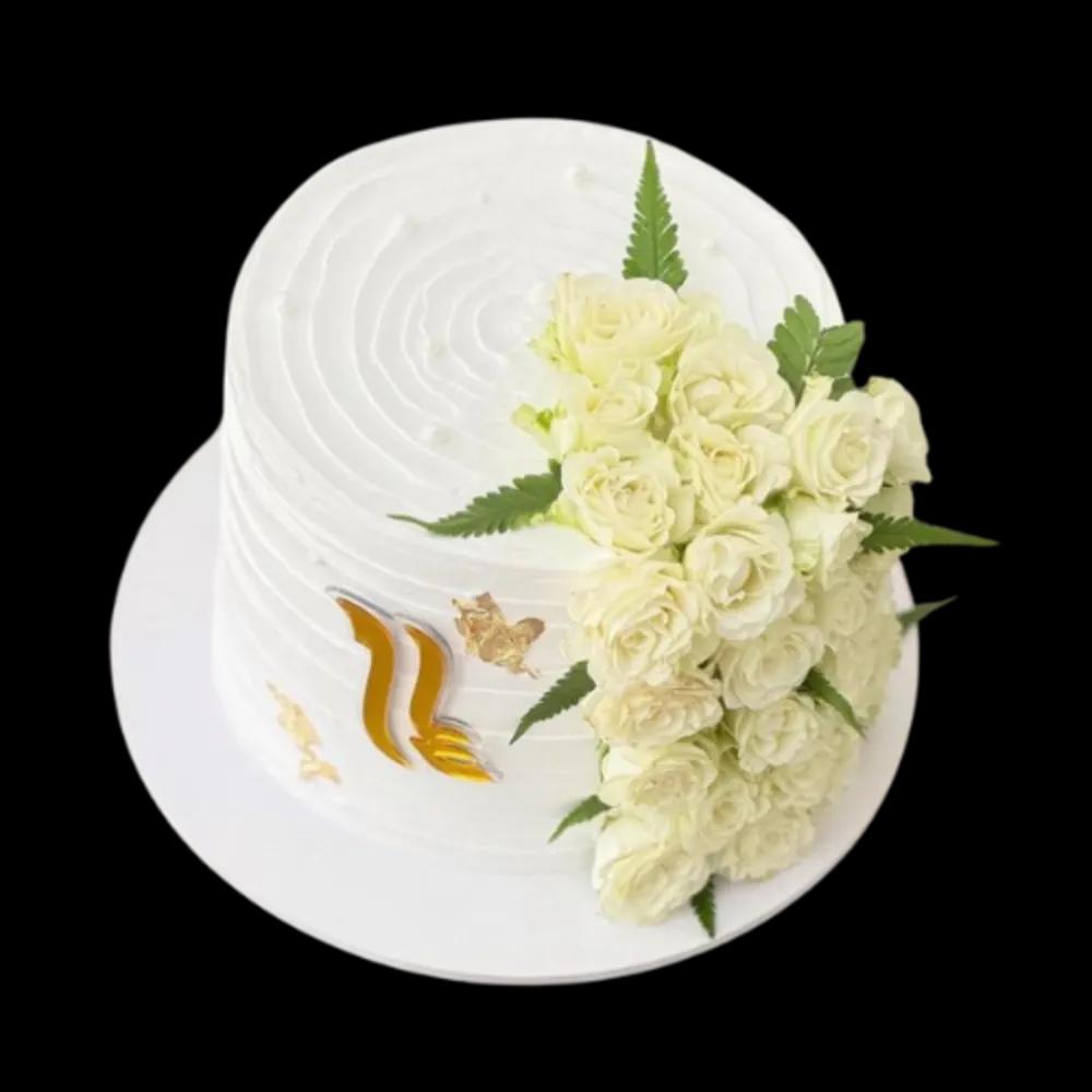 White birthday cake decorated with white rosesundefined