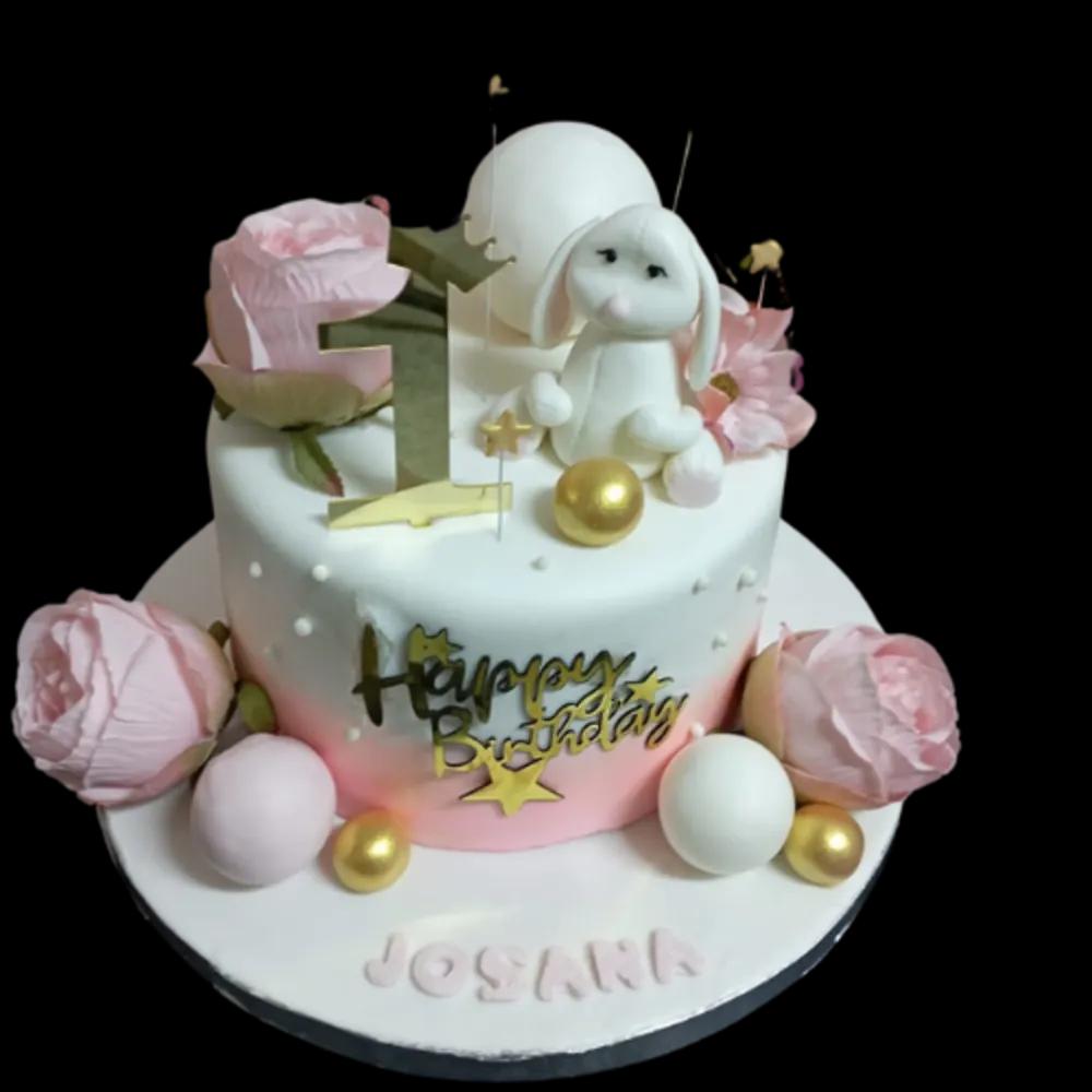 Doll cake and pink rosesundefined