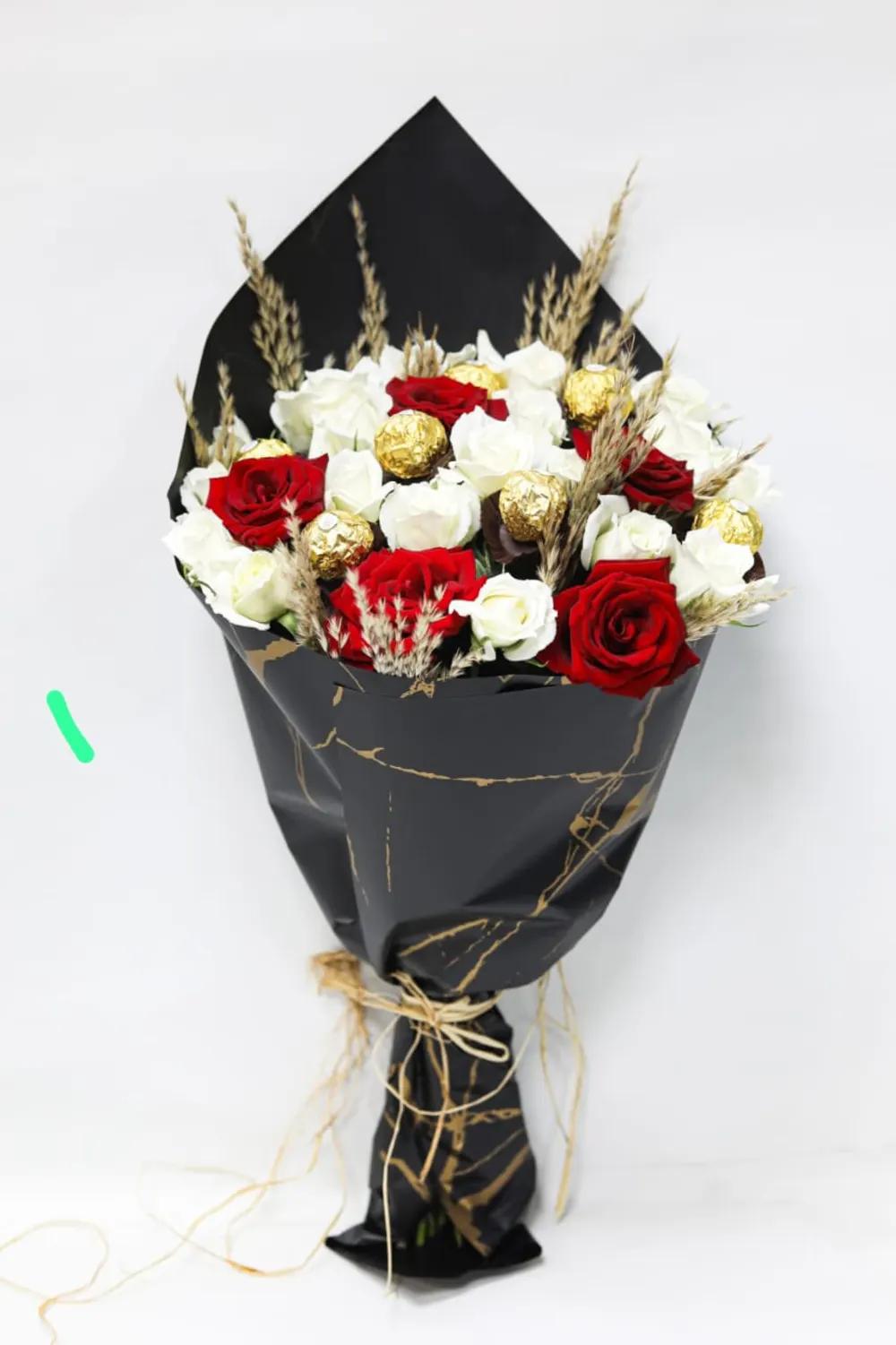 Bouquet with red flowers with chocolateundefined