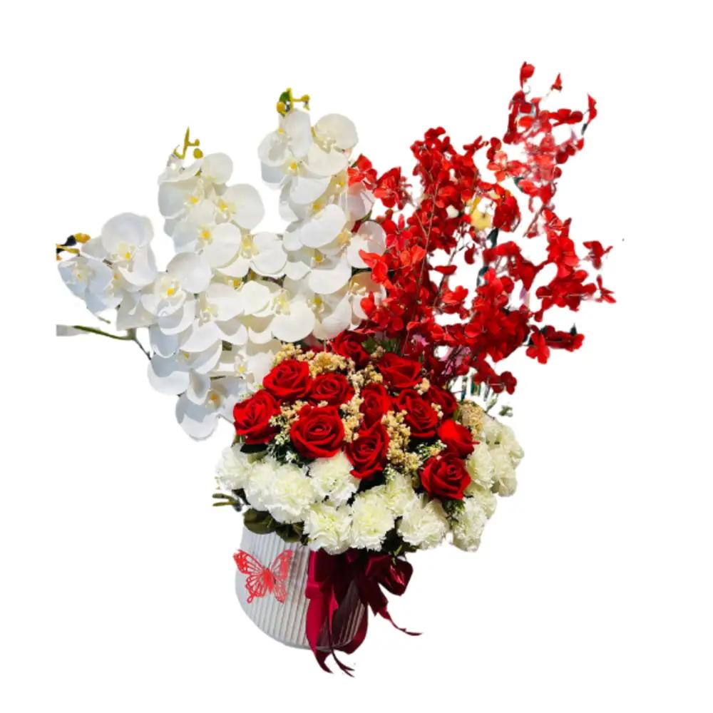 A vase filled with different colored roses in an elegant mannerundefined