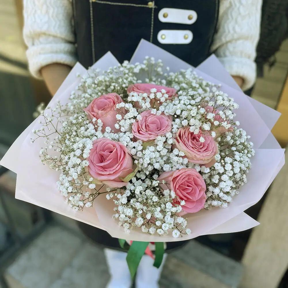 Delicate bouquet with rose and gypsophila