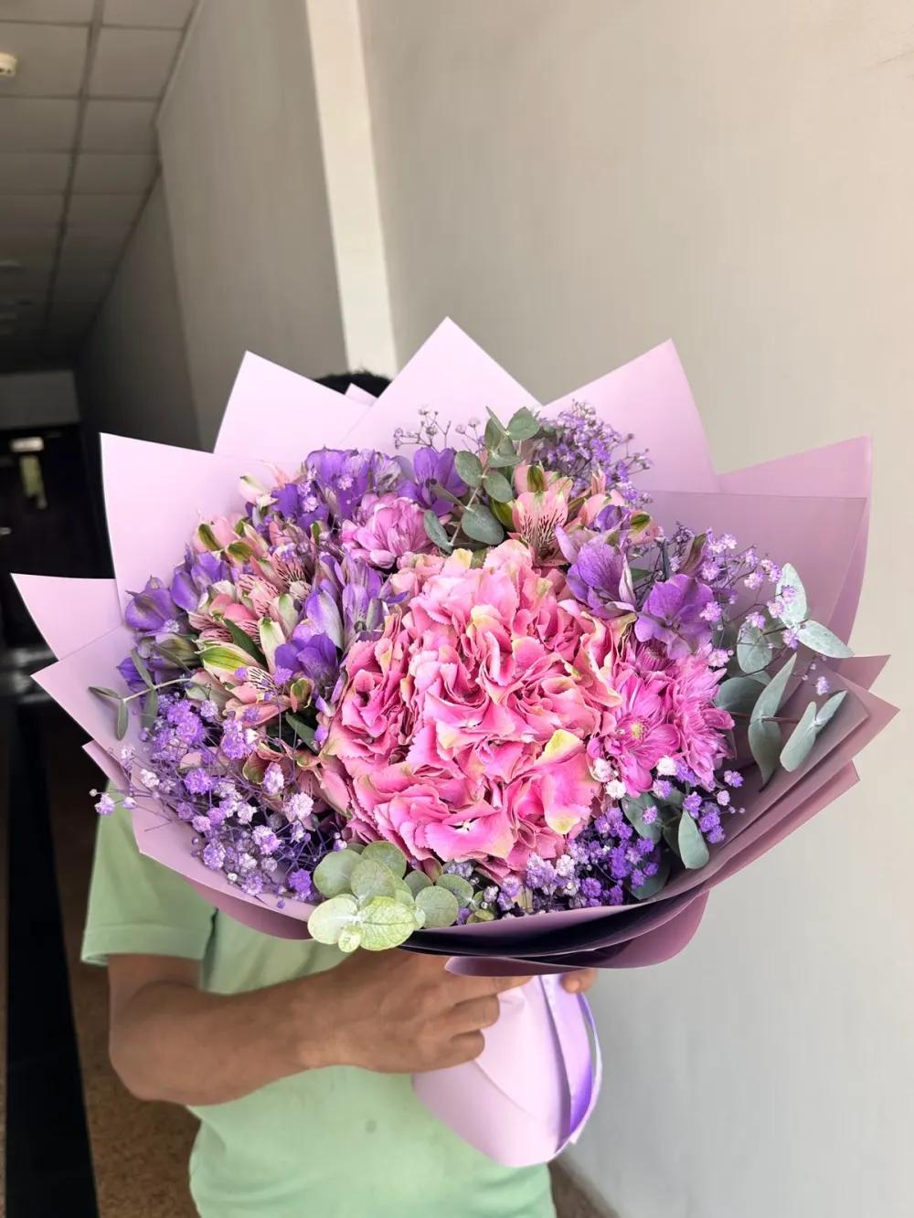 Assorted roses bouquet with purple wrapping