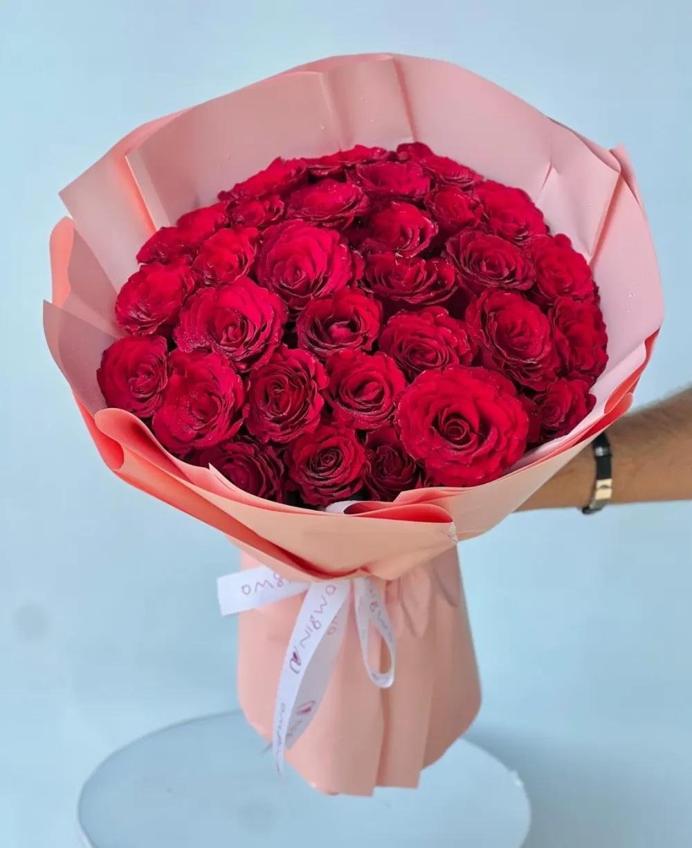Red roses bouquet with hypericum and =