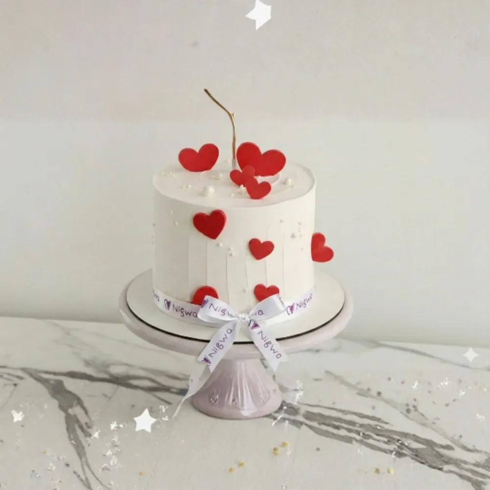 Red Hearts with white butter cream cake - Valentines day cake