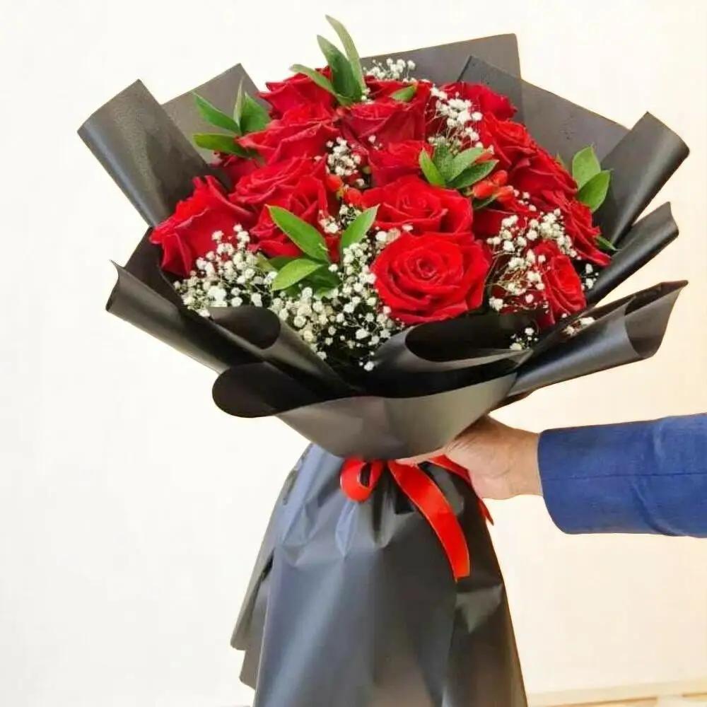 Red rose bouquet with gypsum. 4